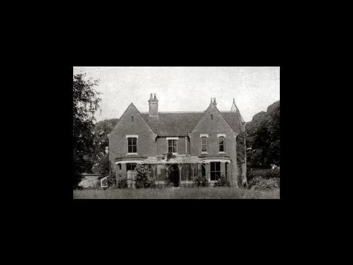 Borley Rectory, abandoned and overgrown before fire ravaged the building.