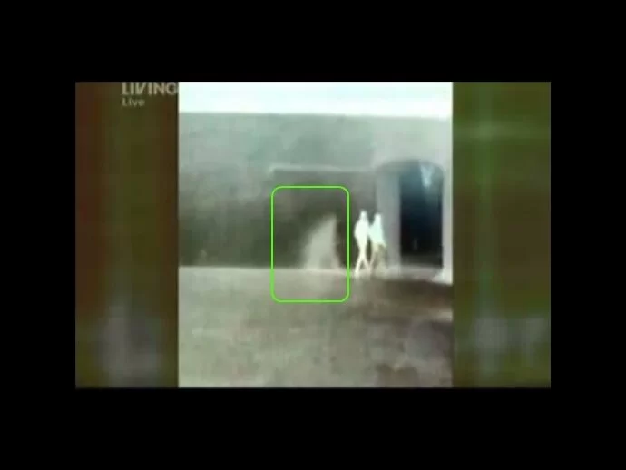 Still shot shows 2 investigators and maybe two ghosts pursuing them?