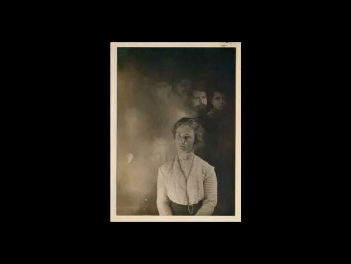 Early 1900s spirit photograph with dramatic lighting...