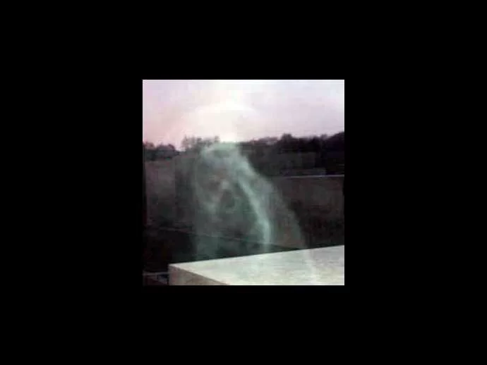 Lightened close-up of the ghost. Is it a woman in a shawl?